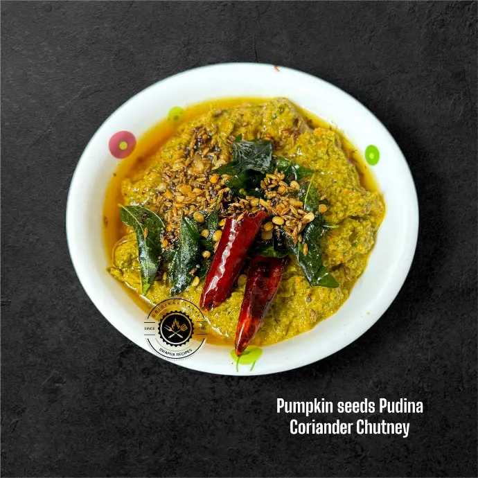Homemade chutney made from pumpkin seeds, fresh pudina, and coriander leaves, ideal as a nutritious and spicy dip for Indian meals.