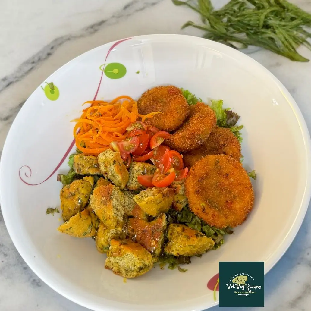 Fresh Golden Cutlet Salad with crunchy lettuce, cherry tomatoes, toasted carrots, paneer cutlets, and spicy butter dressing.