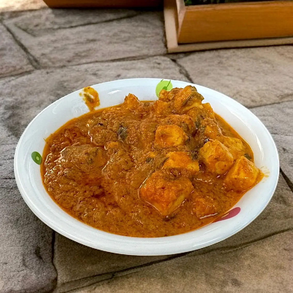 Spicy paneer cubes simmered in rich onion-tomato gravy, garnished with fresh herbs and served hot.