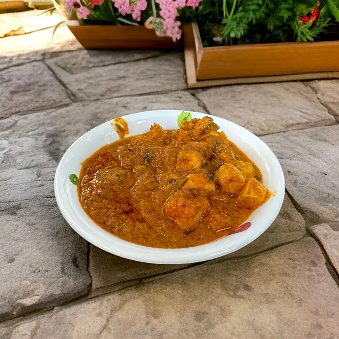 Marinated paneer cooked in aromatic Indian spices with a creamy, flavorful gravy and fresh coriander.