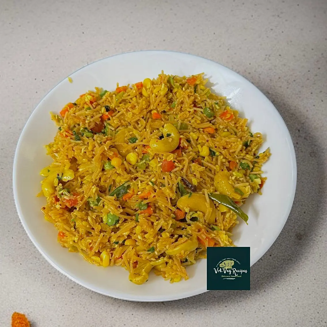 Colorful Vegetable Vermicelli Upma with cashews, moong dal, and aromatic South Indian flavors — hearty & wholesome meal.