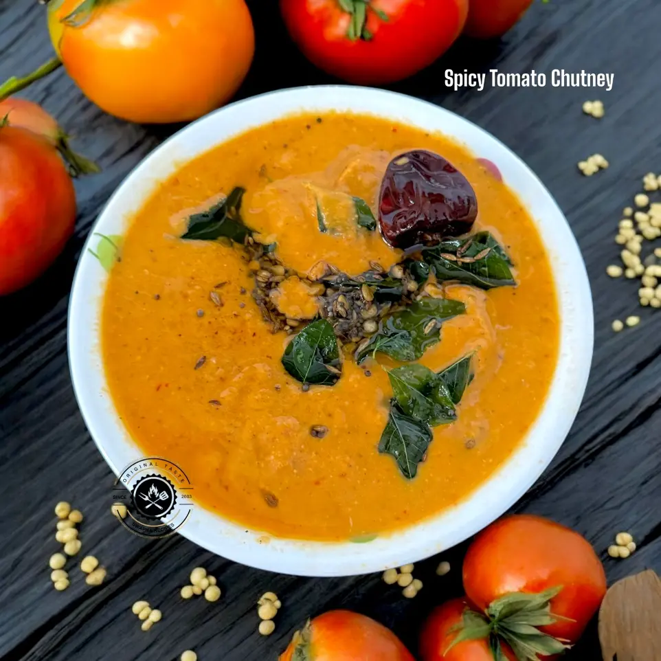 Traditional spicy tomato chutney blended with dals, spices, and sesame seeds, perfect for South Indian breakfasts.