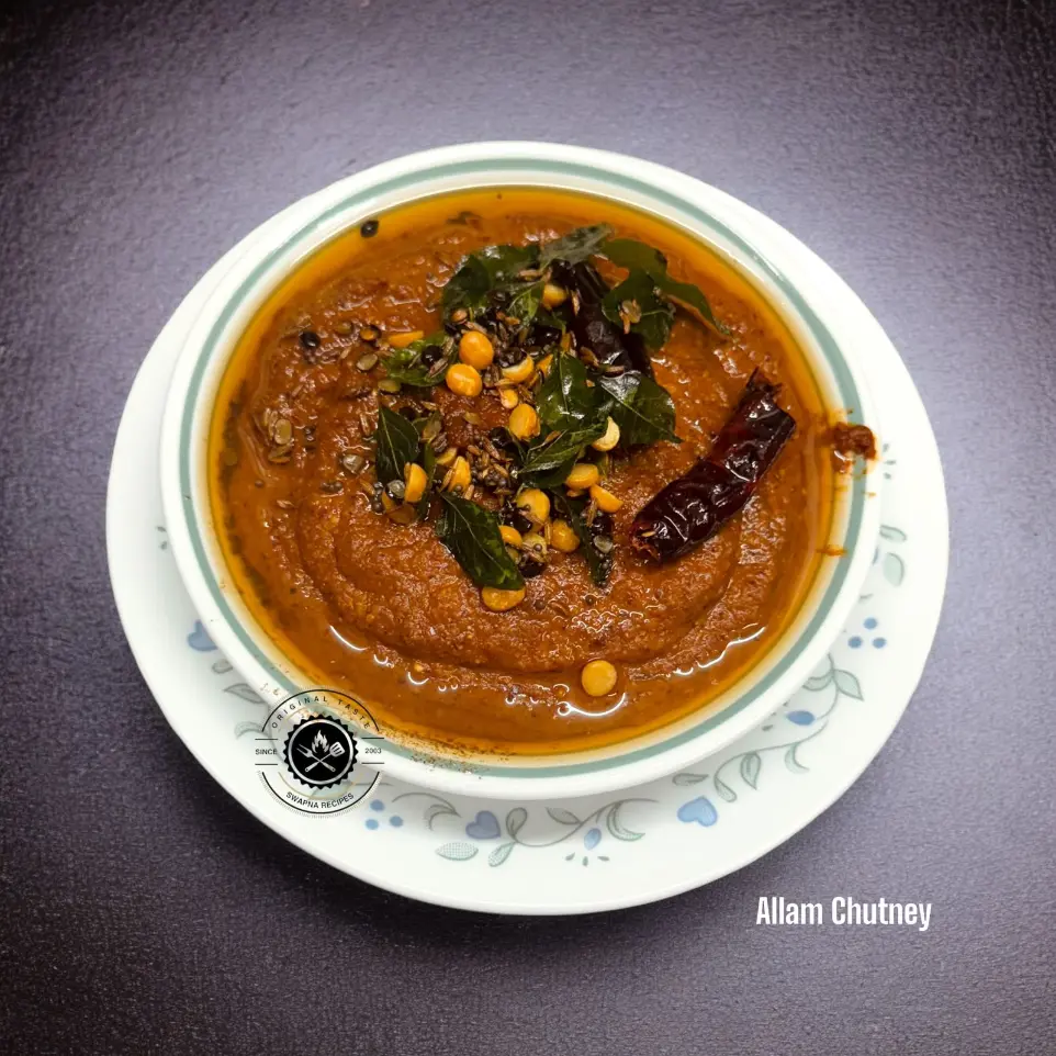 Spicy South Indian Allam Chutney made with ginger, garlic, red chilies, and tamarind, served with dosa and idli.