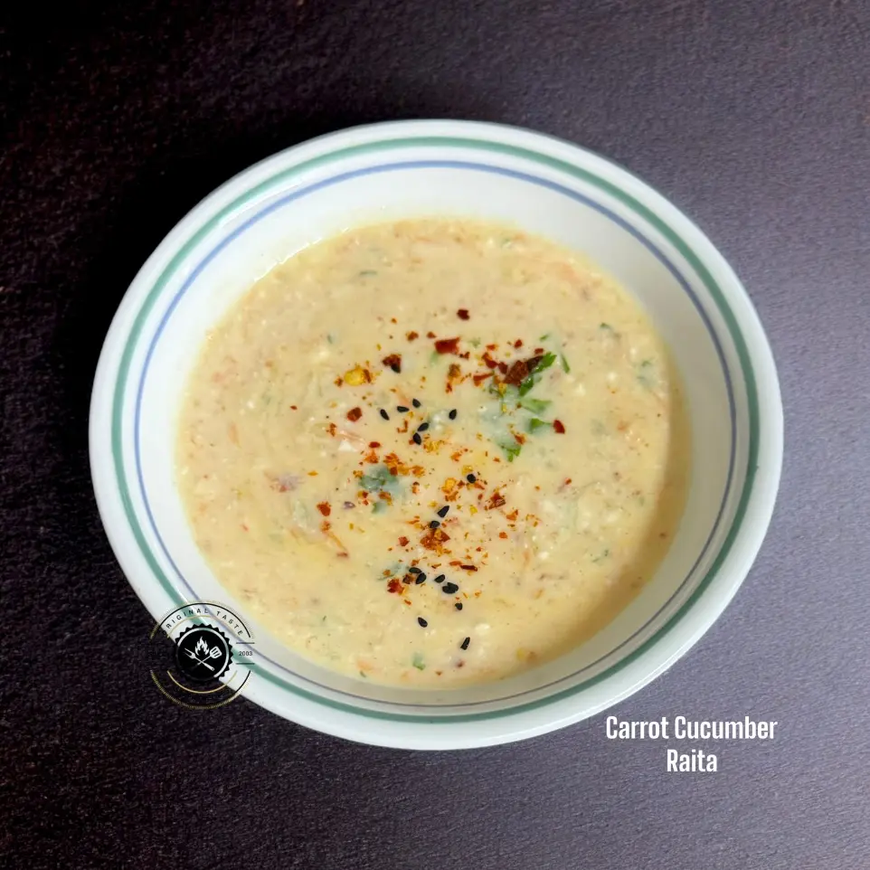 Creamy carrot cucumber raita made with curd, spices, and herbs – the perfect cooling side dish for hot and spicy meals like biryani.