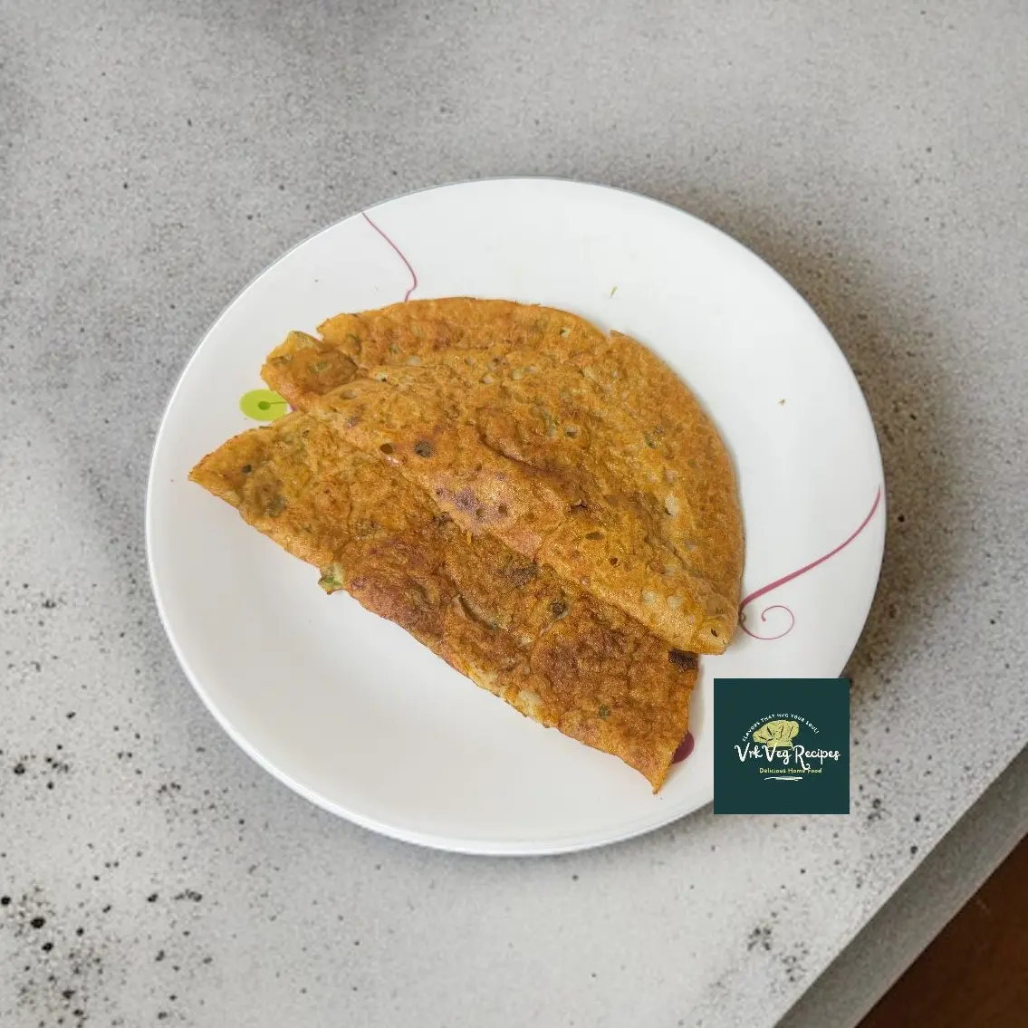 Hot jowar dosa loaded with vegetables, cooked without oil, and served with chutney for a healthy breakfast.