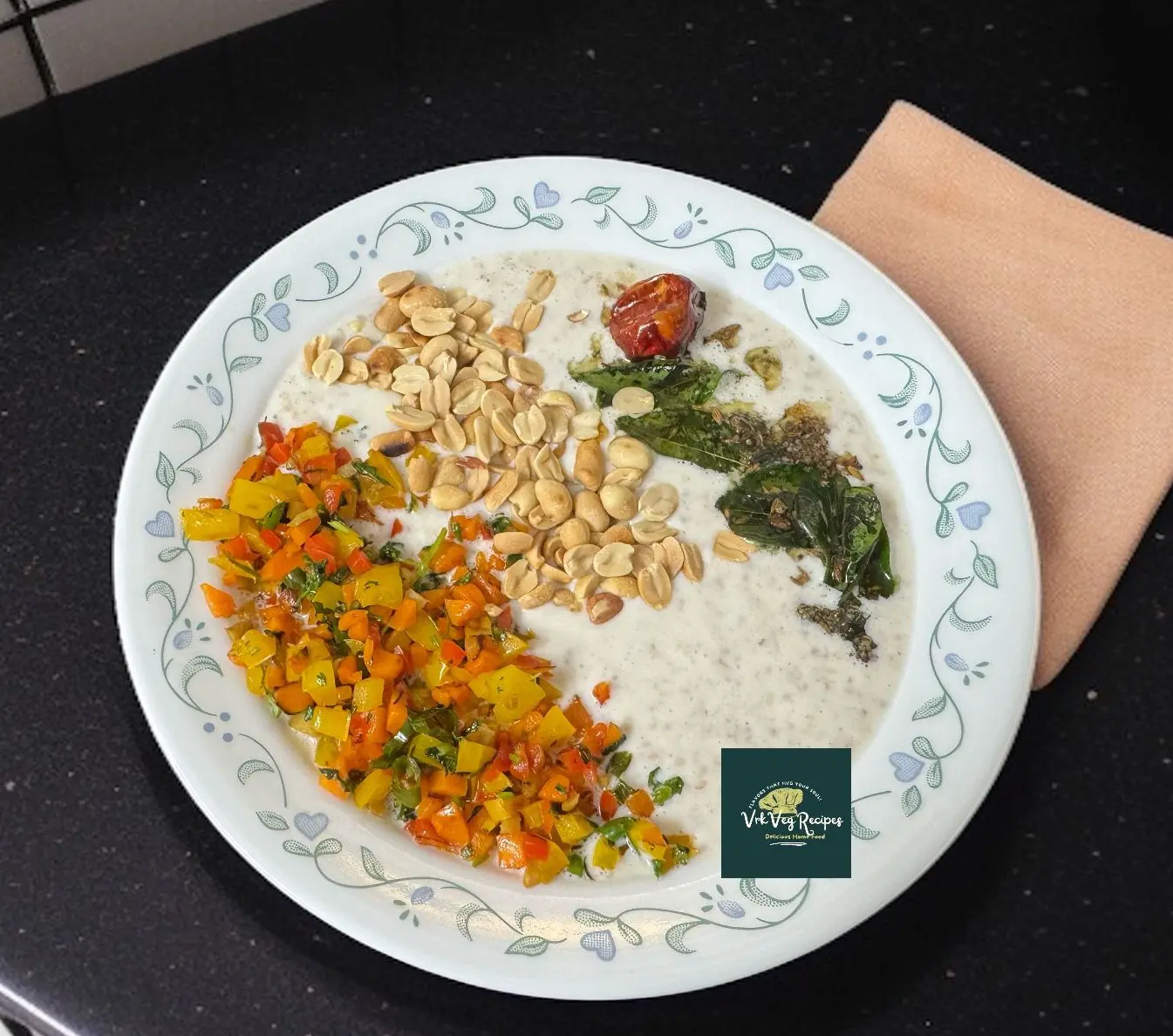 A healthy savory curd oats bowl with sautéed vegetables, crunchy peanuts, and flavorful tempering served in a ceramic dish.