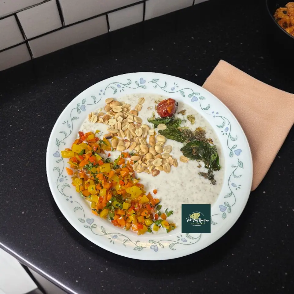 Healthy Gut-Friendly Oats and Curd Power Bowl Nutritious oats curd bowl topped with ghee-roasted capsicum, carrots, peanuts, and curry leaves—perfect gut-friendly meal.