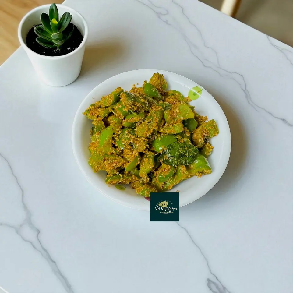 Sesame-Spiced Green Capsicum Stir-Fry Recipe Sesame-coated capsicum stir-fry with shah jeera and curry leaves served hot as a delicious Indian side dish.