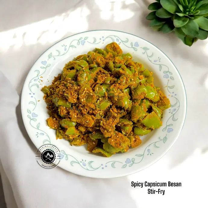 Tangy and spicy capsicum sabzi with besan and sesame – a simple, healthy stir-fry dish perfect for quick meals.