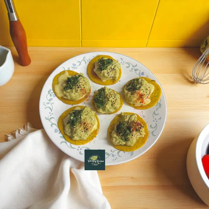 Freshly made Cheesy Besan Pancakes topped with nutritious greens and cheese, perfect for a wholesome meal and beautiful recipe photography.