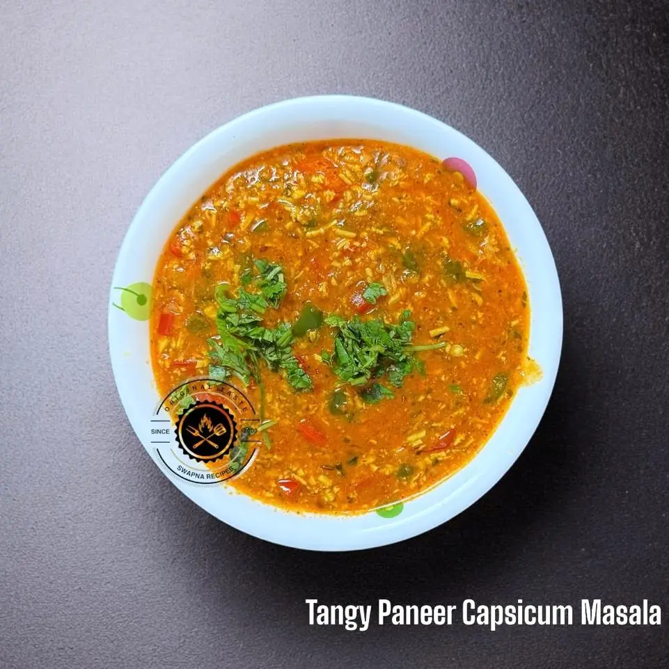 North Indian Paneer Capsicum curry with bold spices, fresh herbs, grated paneer, and colorful capsicum – a perfect dinner served with hot naan.