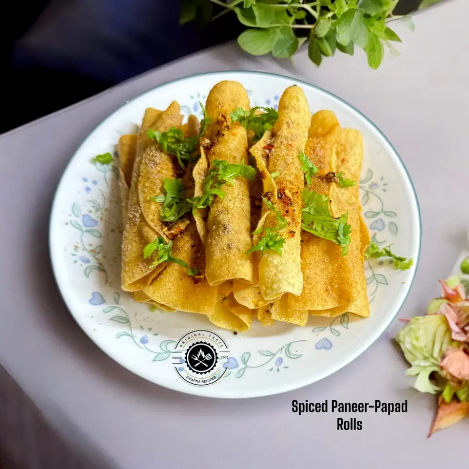 How to Make Paneer-Stuffed Papad Rolls at Home Delicious paneer-stuffed papad rolls served hot with a tangy sprinkle of amchur and chaat masala – an irresistible crispy appetizer.
