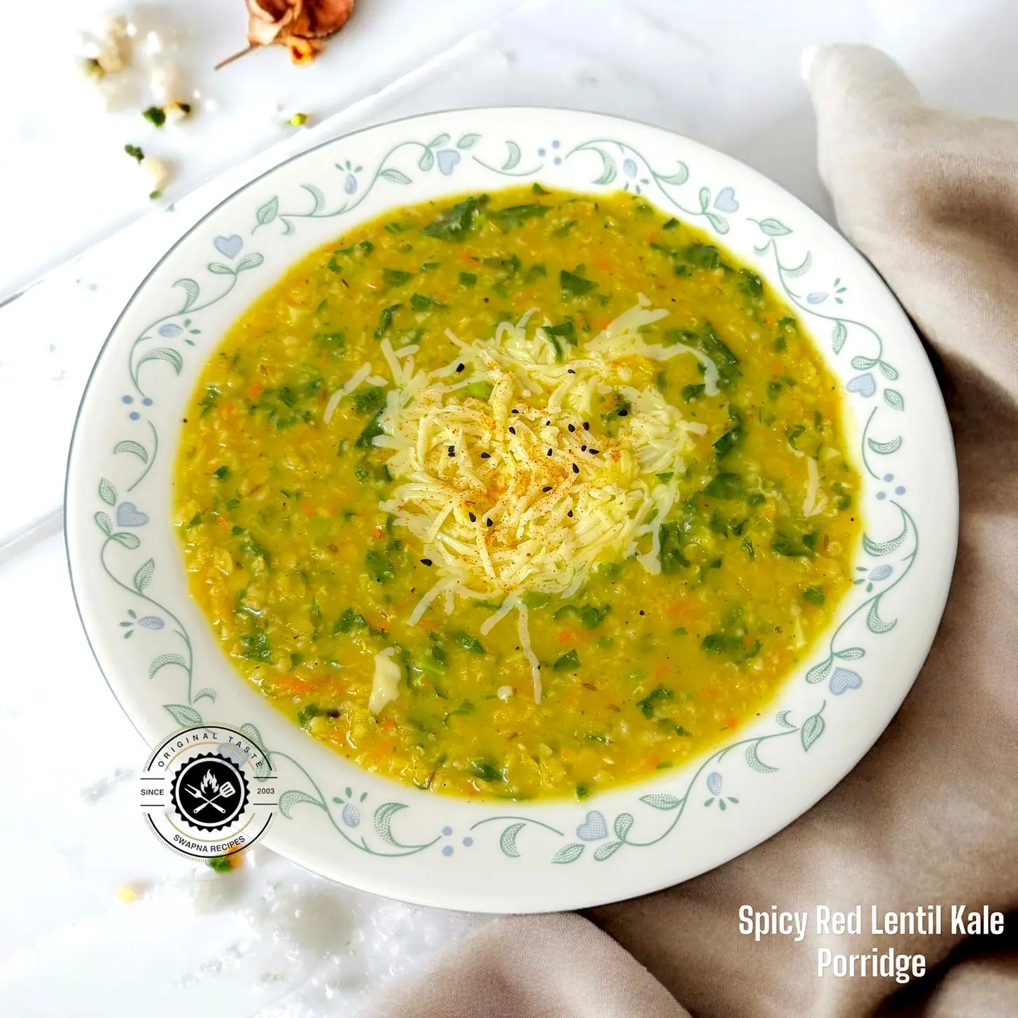 Healthy Red Lentil Porridge With Kale A hearty bowl of spicy red lentil and kale porridge with rich golden broth, perfect for a winter morning meal.