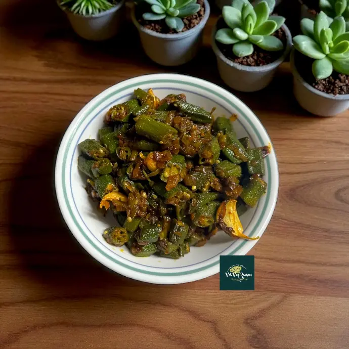 Okra-tastic Tangy Bendi | Spiced Okra with Lemon Twist Close-up of Spiced Bendi: okra and onions seasoned with carom and garam masala, lemon-splashed and garnished with coriander, showing crisp texture.