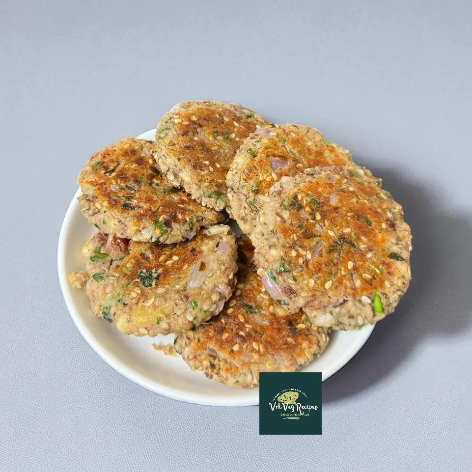 Close-up of golden brown Rajma Paneer Tikki served with green chutney on a plate, crispy and healthy snack for tea time.