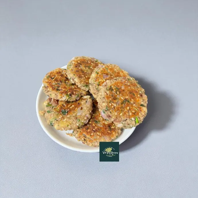 Homemade Rajma Paneer Tikkis in non-stick pan, crunchy outside soft inside, perfect guilt-free snack for adults and kids.