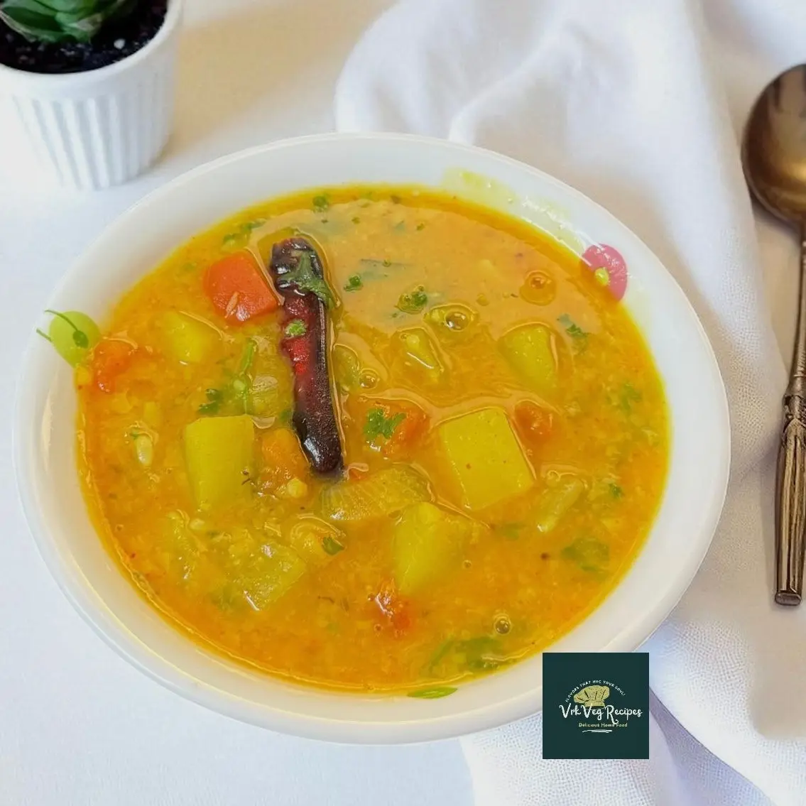 Steaming bowl of Bottle Gourd Sambar with soft lauki pieces, creamy toor dal, chopped coriander and cracked black pepper; served hot with rice or idli.