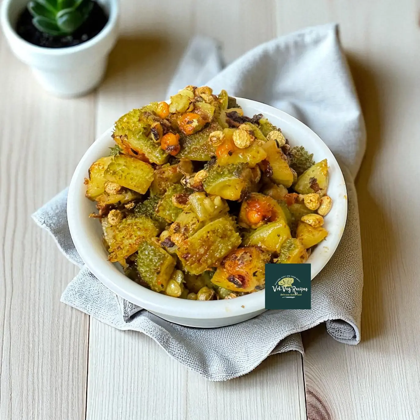 Golden crispy kakarakaya fry made with just 2 tablespoons of oil, perfectly cooked and sprinkled with salt and red chilli powder for a healthy side.