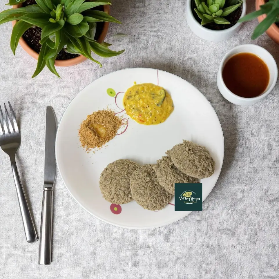 Steaming Green Moong–Urad Idlys on a plate with coconut chutney, perfect for a healthy, filling, and tasty vegetarian breakfast meal.