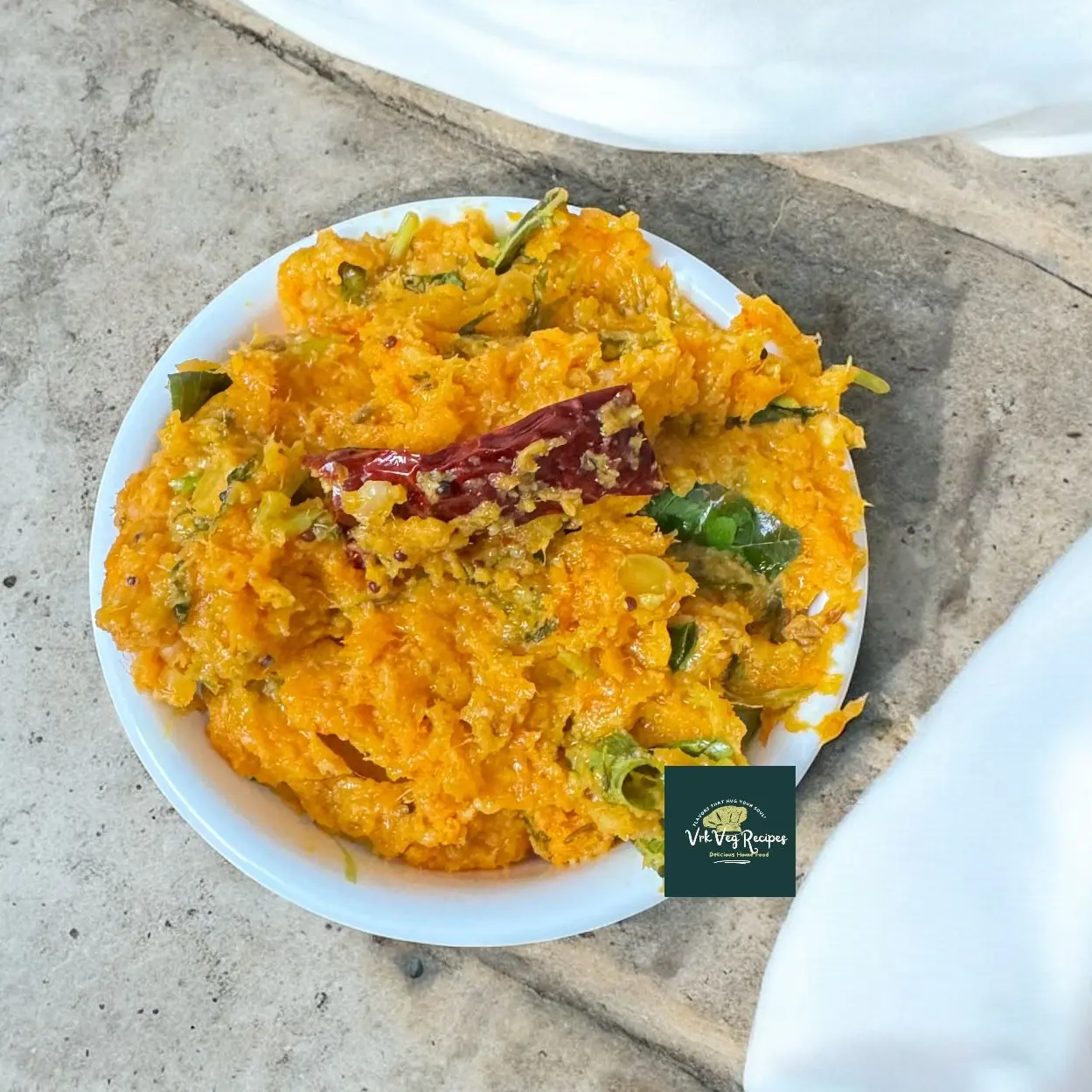 Vibrant Carrot Raw Mango Chutney with spicy garlic and tangy raw mango flavors, tempered with curry leaves and dals for a South Indian twist.