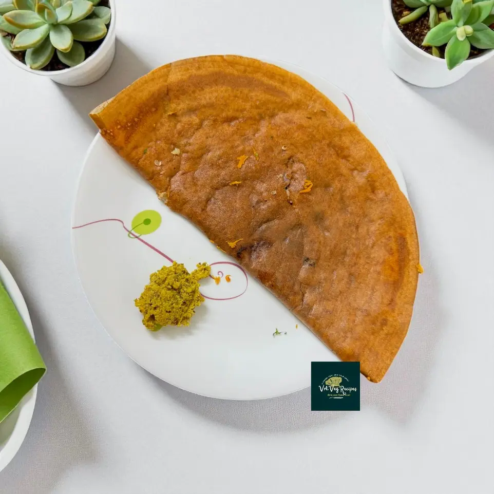 Close-up of crispy Rajgiri Urad Chana Dosa on a hot tawa, golden-brown edges and soft center, served with coconut chutney — gluten-free, protein-rich breakfast delight.