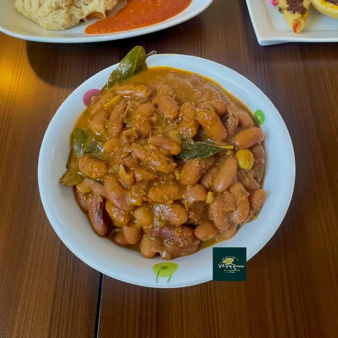 Creamy Rajma Masala simmered in rich onion-tomato gravy with aromatic spices, a perfect North Indian comfort dish served with hot jeera rice.