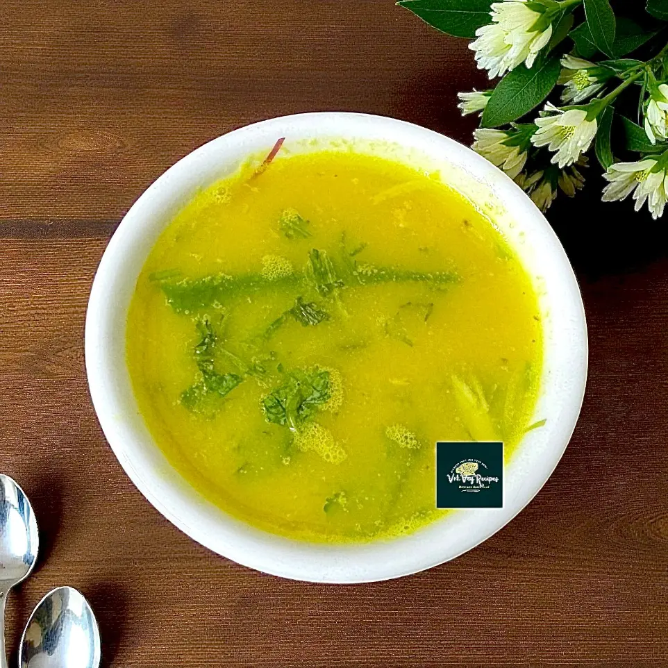 Moong Dal Garlic Rasam served hot, bursting with garlic aroma, curry leaves, and moong dal goodness — perfect for cozy meals.