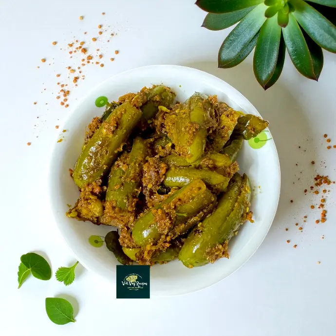 Tindora masala fry recipe featuring onion, urad dal, pepper, and red chilli — a crunchy and spicy South Indian-style dondakaya side dish.