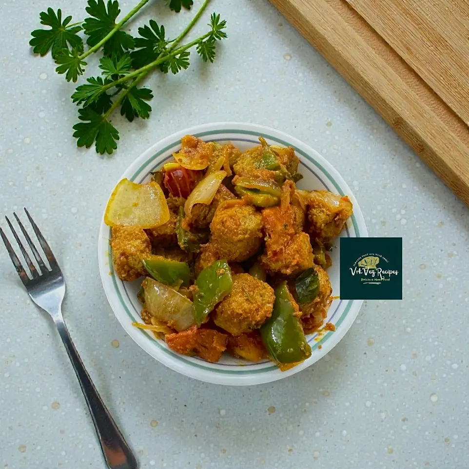 Spicy kadai soya chunk stir fry cooked with capsicum, onion, garlic and tomato masala, served hot with roti in a home-style vegetarian meal.